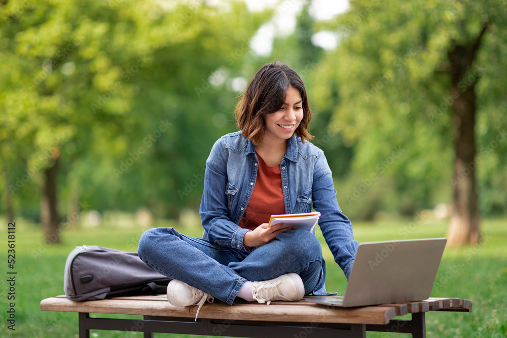 Young Arab Female Student With Laptop And Notepad Study Outdoors Young Arab Female Student With Laptop And Notepad Study Outdoors