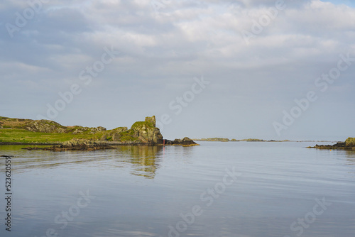 The ruins of Dunyvaig Castle and Lagavulin Bay on the Isle of Islay in Scotland  photo