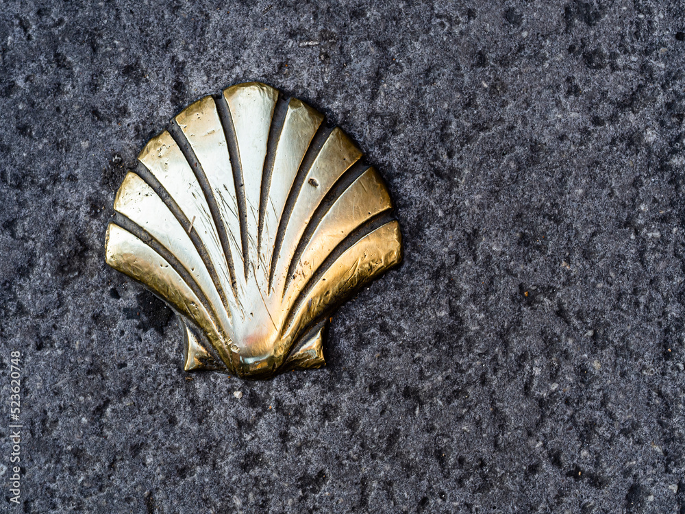 Scallop, symbol of the Santiago road, on the streets of León, Castilla y León, Spain. Scallop, symbol of the Santiago road, on the streets of León, Castilla y León, Spain.
