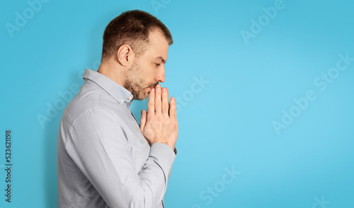 Unhappy Middle Aged Man Thinking Holding Hands Near Face, Studio © Prostock-studio