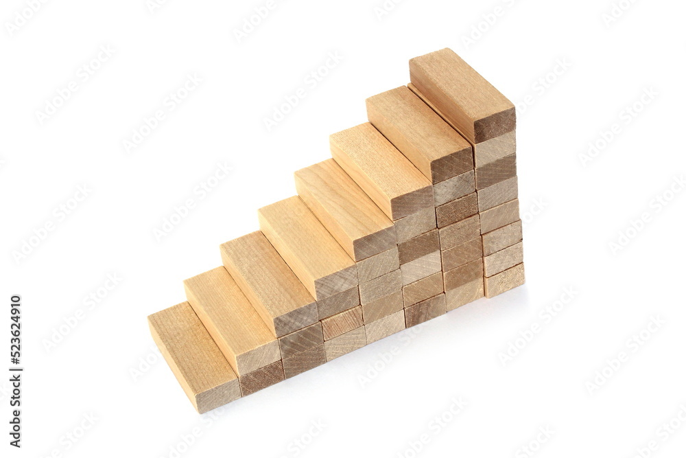 Tower of wooden blocks on a white background in the form of stairs. Tower of wooden blocks on a white background in the form of stairs.