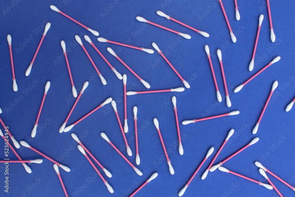 Abstract background of cotton buds on a blue background.