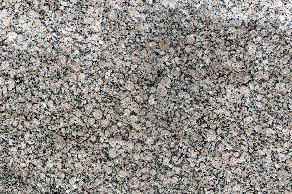 Abstract gray texture of stone material with patterns in the form of numerous spots. Abstract gray texture of stone material with patterns in the form of numerous spots.