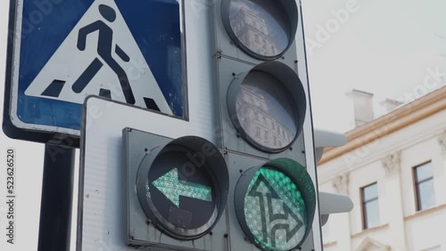 traffic light signal in the city, works green and switches to red. Road sign pedestrian crossing