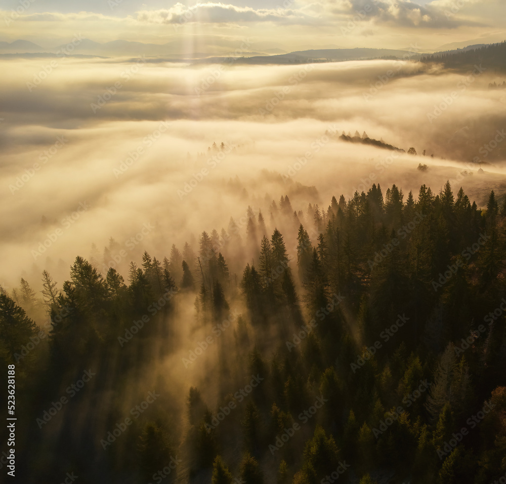 Sunset over the mountains in the Carpathians. Aerial drone view.