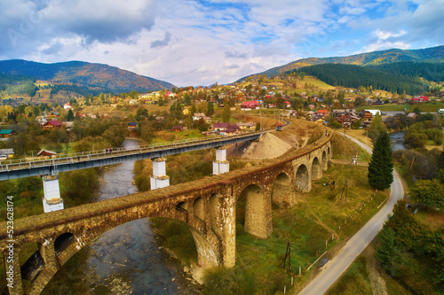 Aerial view amazing over Viaduct is an Austrian stone arch bridge in Vorokhta Ukraine. Cloudy autumn day in the the Carpathian Mountains