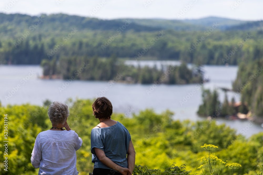 Two women are looking at a beautiful landscape Two women are looking at a beautiful landscape