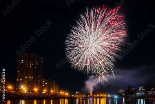 fireworks over the river in the city