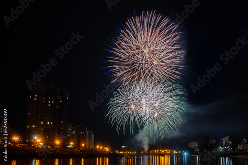 fireworks over the river in the city