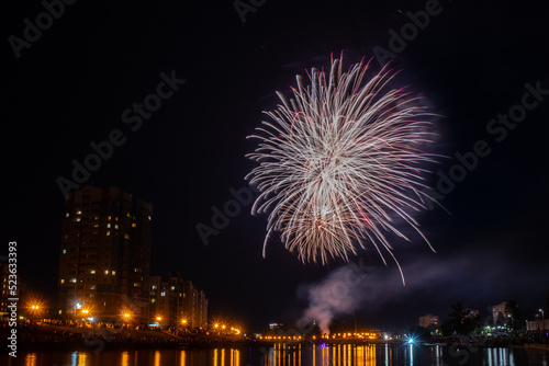 fireworks over the river in the city
