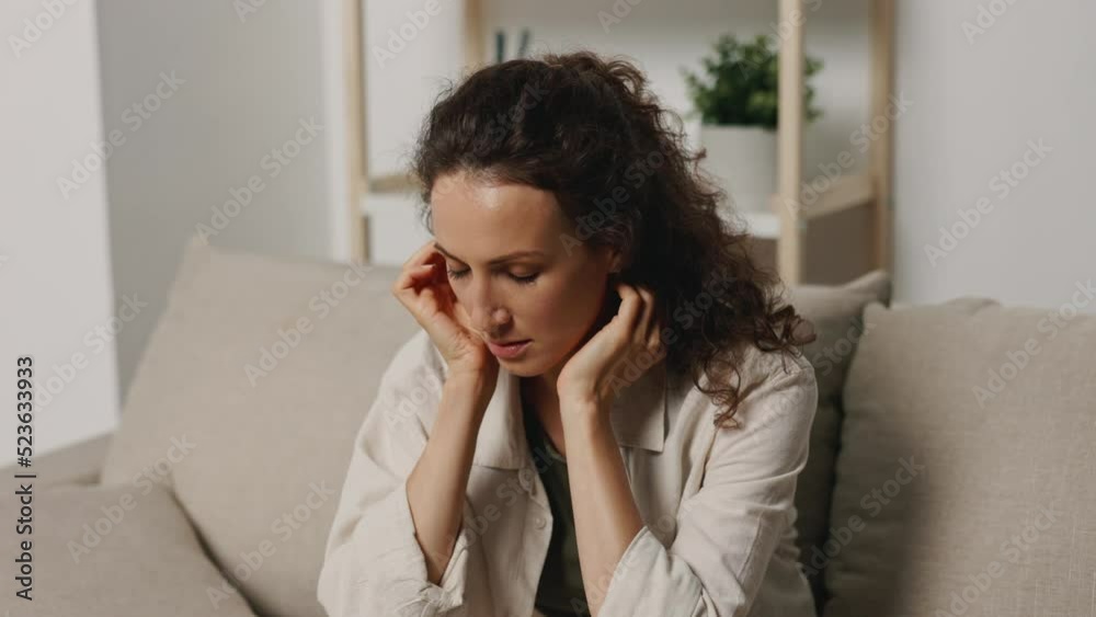 Hysterical and depressed woman at home screaming and crying from severe emotional mental illness after a long depression is very sad Hysterical and depressed woman at home screaming and crying from severe emotional mental illness after a long depression is very sad