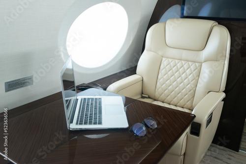 Private Jet interior luxury with computer 