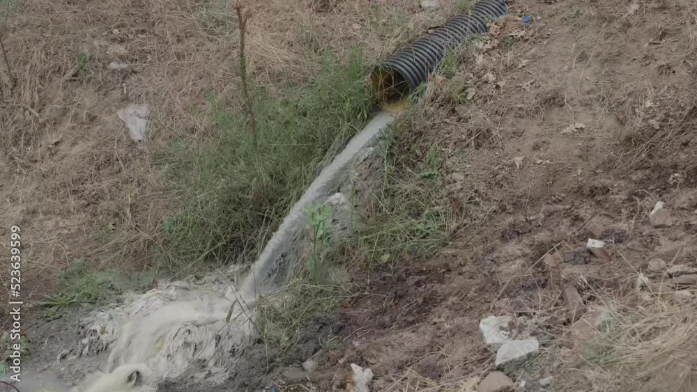 Sewage water pollution flows from dirty sewers pipe. Turbid water outflow pipe Sewage water pollution flows from dirty sewers pipe. Turbid water outflow pipe