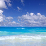 Travel background with Caribbean sea and clouds sky.