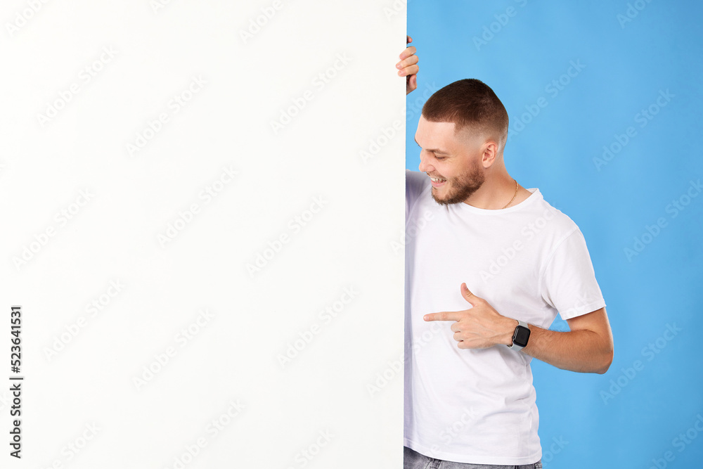 cheerful man holding board with empty copy space cheerful man holding board with empty copy space