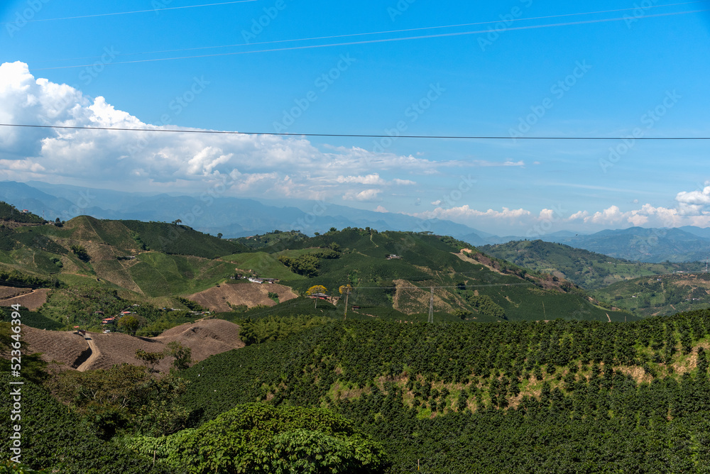 Crop fields between hills in a Colombian country landscape.
