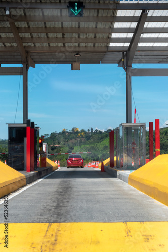 Car going through a highway toll in Colombia