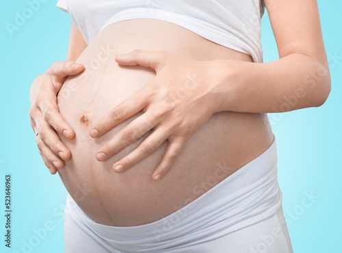 Wallpaper Mural Young healthy woman hand made heart shape on her stomach. Concept of good digestive, healthy gut, probiotics, slim fit, gynecology and woman health care. Torontodigital.ca