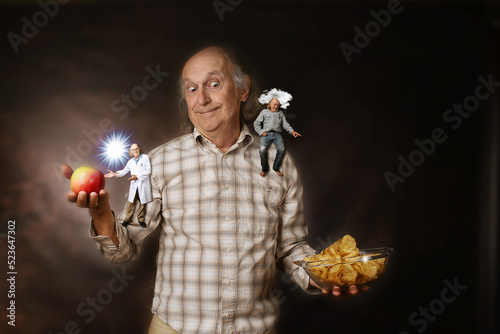 Fotografi Man struggling between eating healthy food or junk food, confronted by two diffe