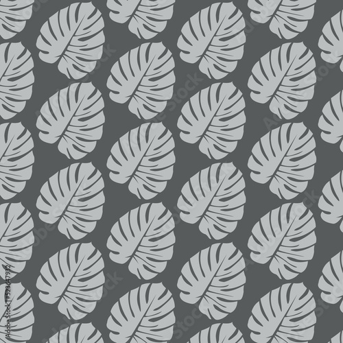 Monochrome monstera leaves seamless pattern. Abstract tropical plant repeating on grey backround. Vector illustration.