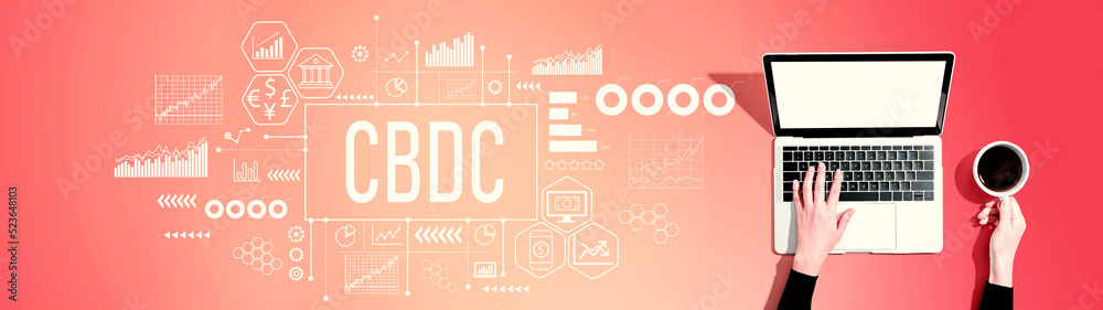 CBDC - Central Bank Digital Currency Concept with person using a laptop computer CBDC - Central Bank Digital Currency Concept with person using a laptop computer