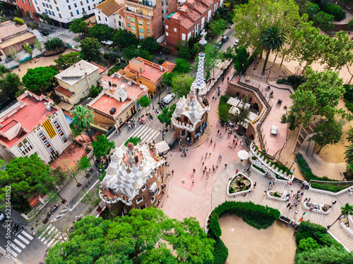 Drone shot Park Guell in Barcelona. Panoramic view of the city of Barcelona. Spain from drone. Park at the top of Barcelona. Drone view of gardens and residential areas in Spain.