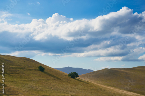 Summer landscape at Forca di Presta, Monti Sibillini national park in Umbria, Italy photo