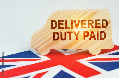 On the flag of Great Britain there is a truck with an inscription - DELIVERED DUTY PAID photo