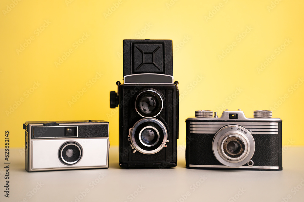 antique retro old film analog nostalgia vintage cameras yellow background colorful