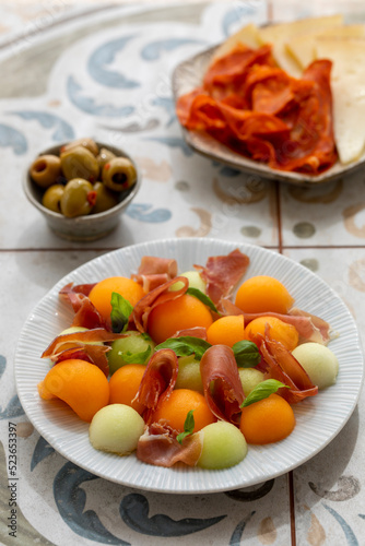 Spanish tapas, melon and ham, olives, cheese and chorizo