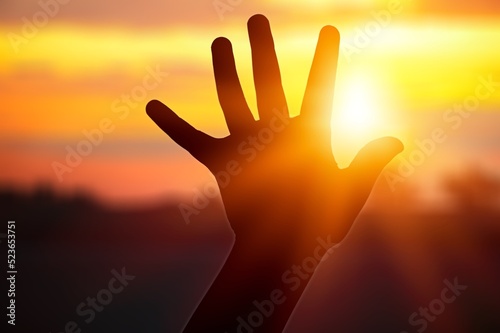 A hand silhouette sunlight. christian business love religion concept. christianity and religion belief in god.