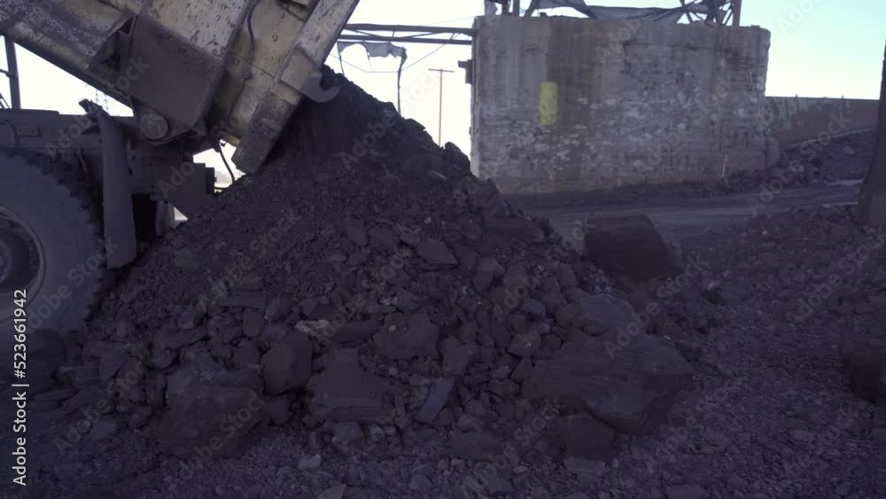 Coal is pouring out.
Coal pouring from truck.
