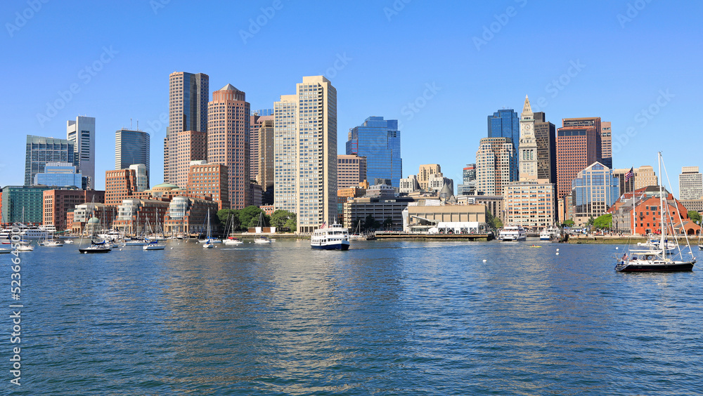 Boston skyline and harbor at dusk with Atlantic Ocean on the foreground, USA 