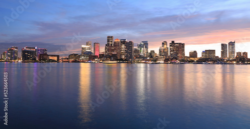 Boston skyline and harbor at dusk with Atlantic Ocean on the foreground, USA  © vlad_g