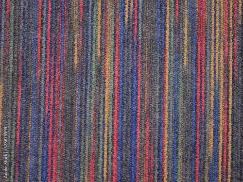 カラフルな色の糸が縦に編まれた布地のテクスチャー