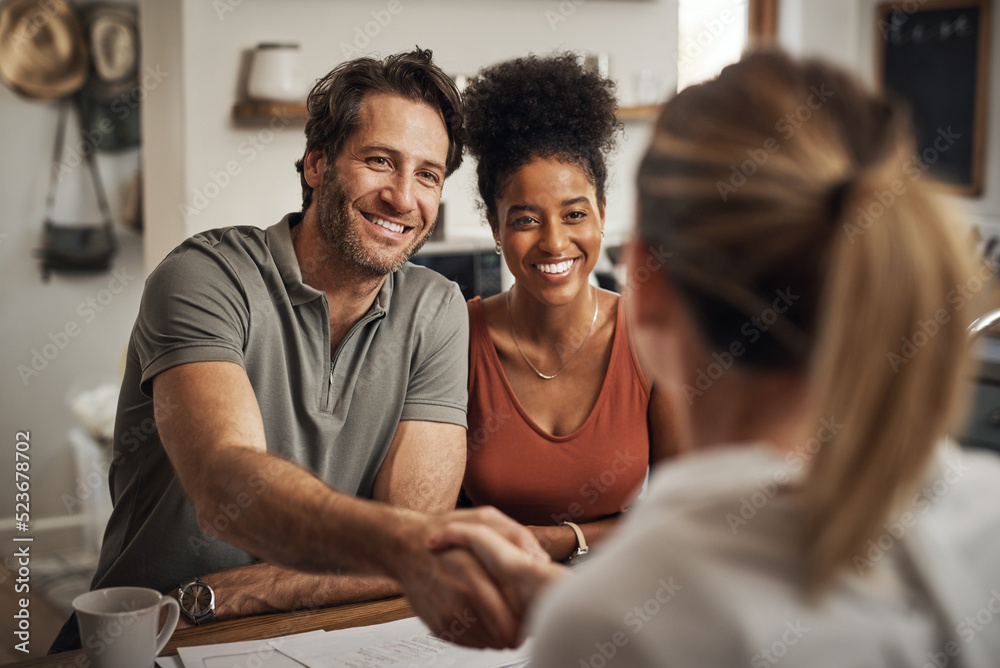 Married couple doing handshake with lawyer, legal advisor and attorney for signing property agreement, investing or sharing assets. Husband and wife thanking after consulting with law paralegal Married couple doing handshake with lawyer, legal advisor and attorney for signing property agreement, investing or sharing assets. Husband and wife thanking after consulting with law paralegal