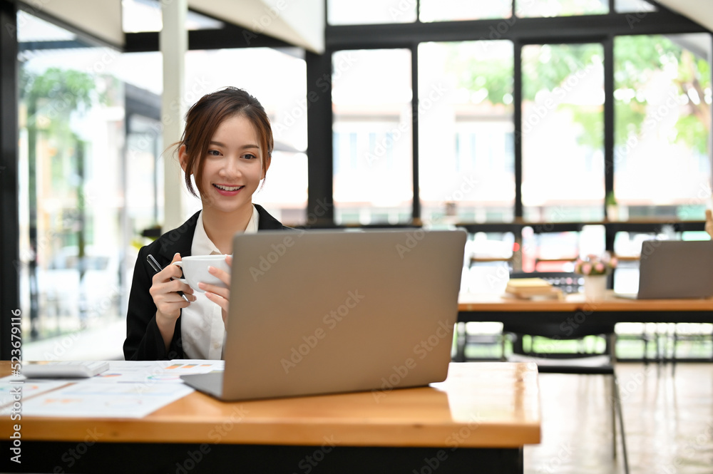 Asian businesswoman remote working in the coffee shop Asian businesswoman remote working in the coffee shop