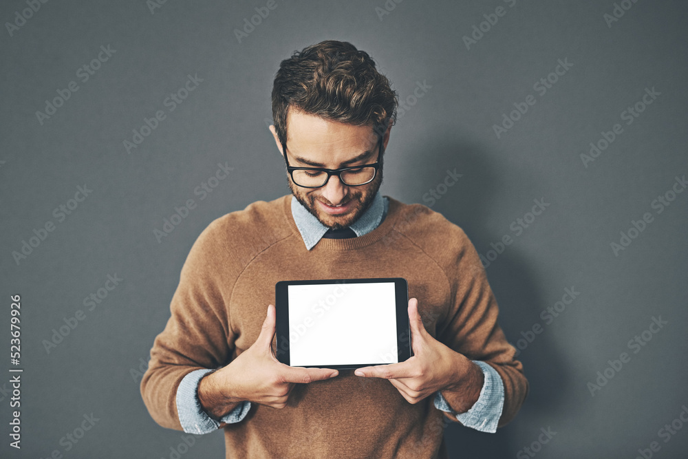 Person holding copyspace, blank and empty tablet screen with an internet app in studio against a grey background. Advertising, marketing and endorsing a product, service or website with copy space Person holding copyspace, blank and empty tablet screen with an internet app in studio against a grey background. Advertising, marketing and endorsing a product, service or website with copy space
