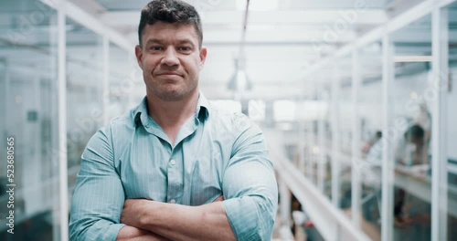 Confident and proud business man standing with arms crossed in union and looking successful working in office. Portrait of honest male manager or real people expressing leadership, success and power photo