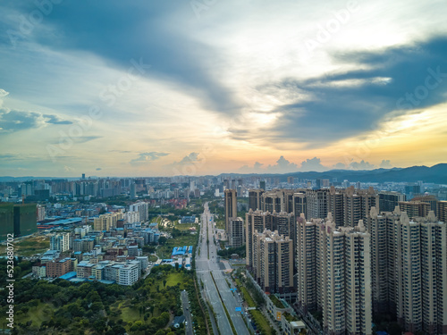 City building complex buildings and highway landscape in evening sunset