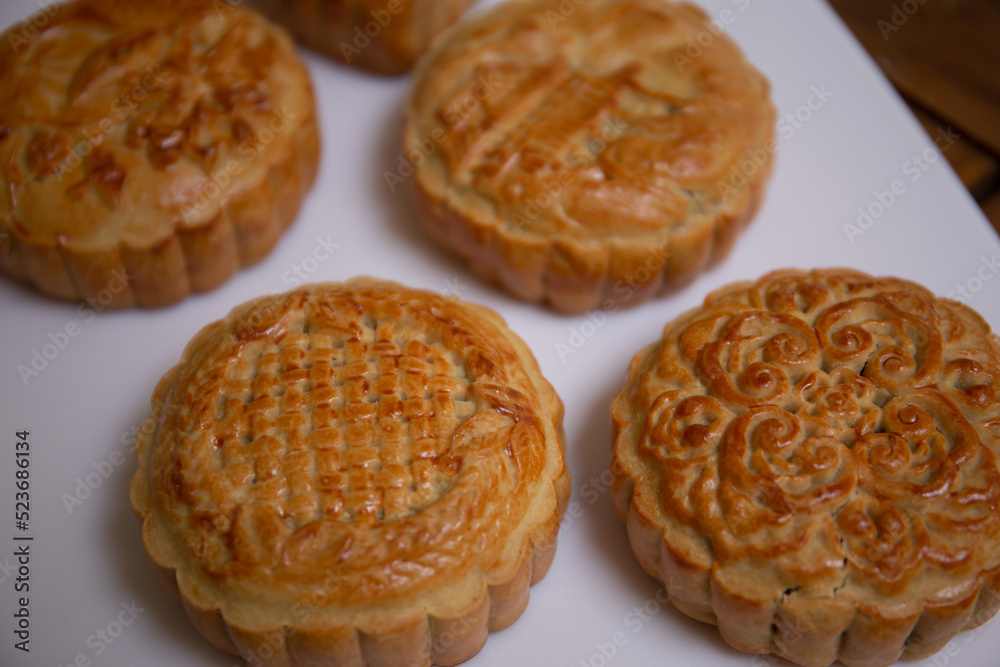 Delicious mung bean moon cake for Mid-Autumn Festival food mooncake on wooden table background for afternoon tea, holiday celebration serving.