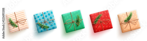 Christmas gifts vector set. 3d realistic gift with twine ribbon, pine leaves and wrap pattern in colorful collection characters for xmas present design. Vector illustration.
