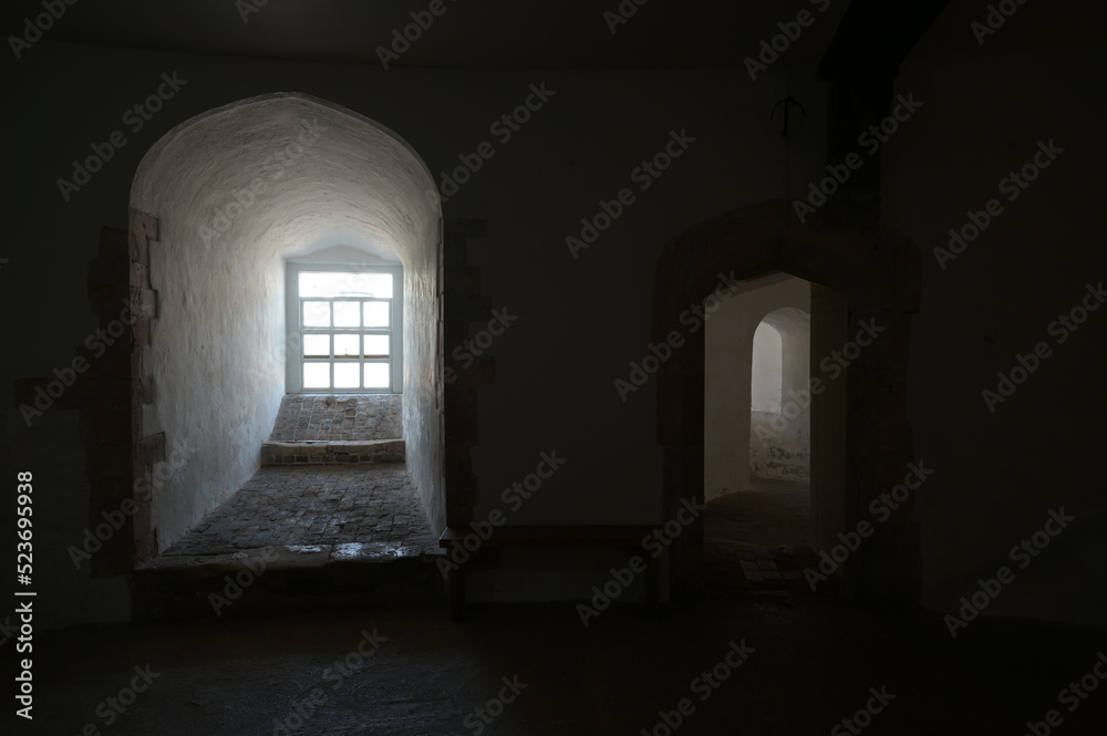 Bright sunlight finding its way into the interior of a coastal fortress in kent.