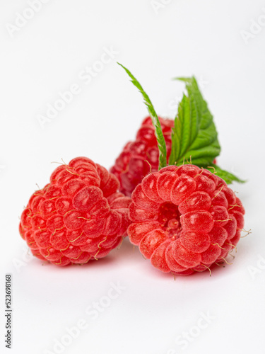 Raspberries isolated on white background close up. Raspberries Clipping Path. Mint Raspberries macro studio photo