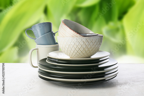 Set of clean dishes on whit...