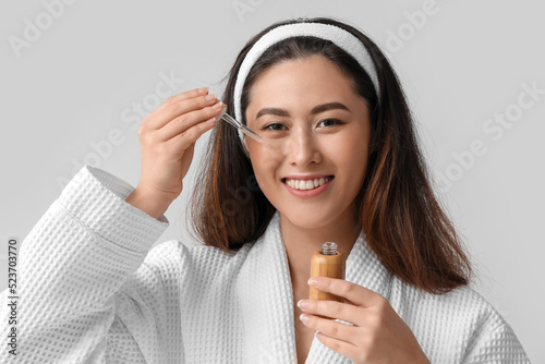 Young Asian woman with cosm...