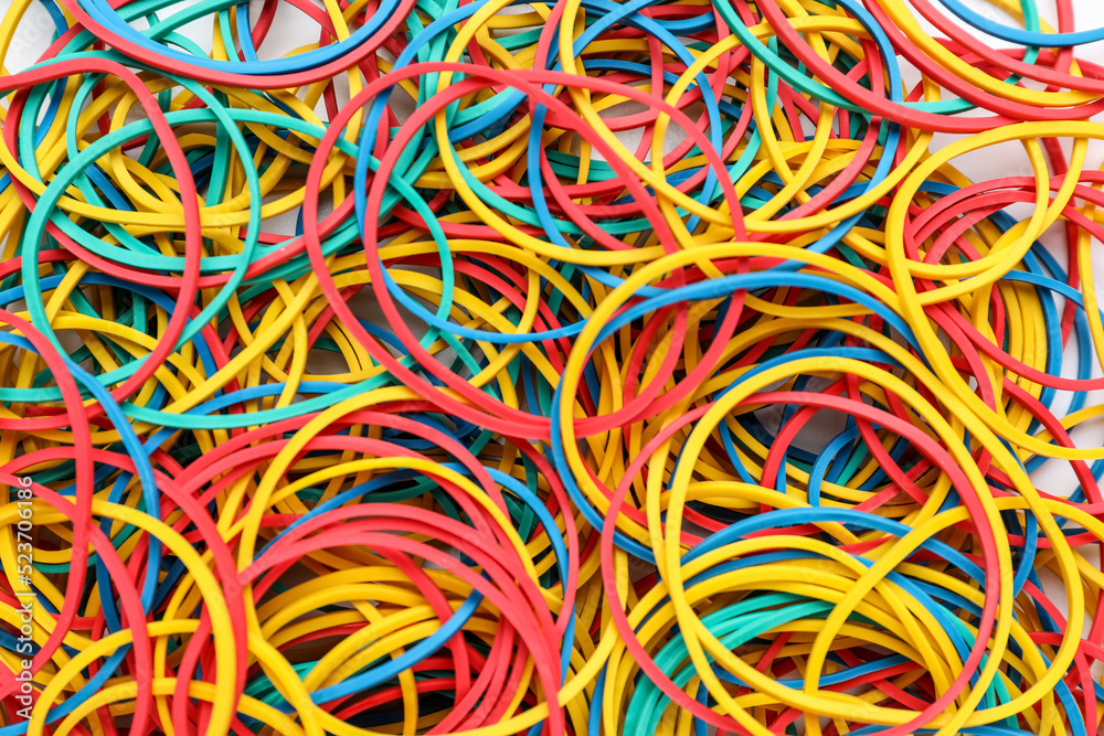 Many colorful rubber bands as background, closeup