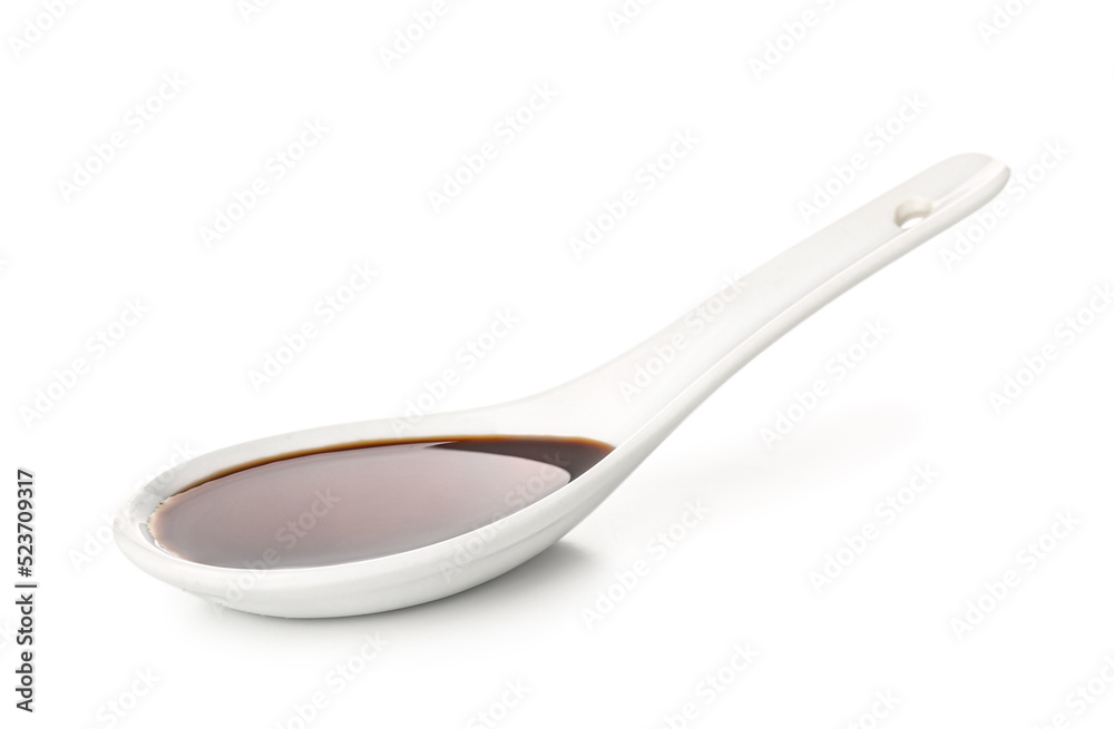 Spoon of soy sauce on white background Spoon of soy sauce on white background