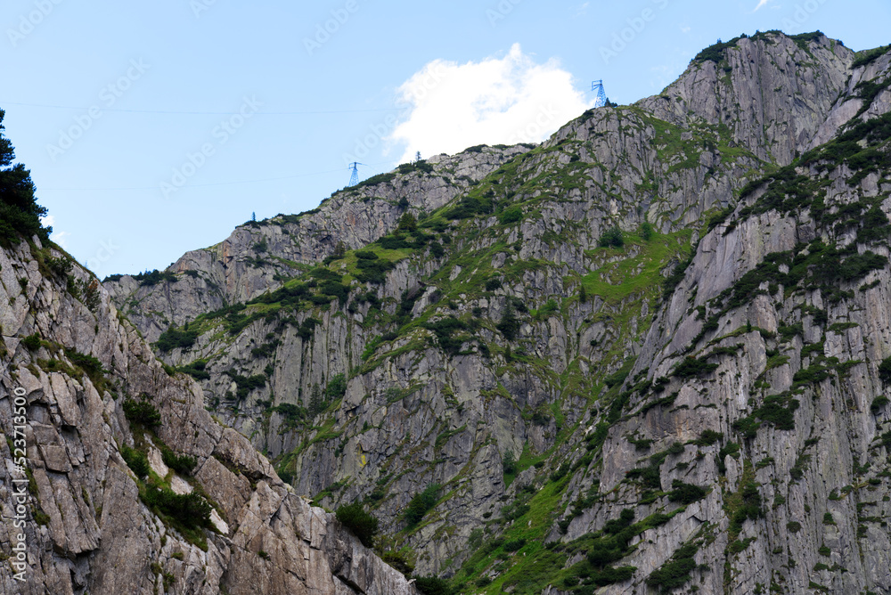 Scenic view of rocks and mountains at Schöllenen Gorge, Canton Uri, on a sunny summer day. Photo taken July 3rd, 2022, Schöllenen Gorge, Switzerland.