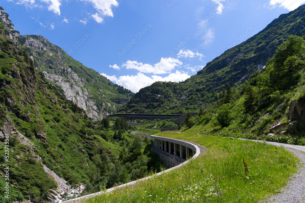 Scenic landscape with avalanche protection gallery of Swiss mountain pass road at Schöllenen Gorge on a sunny summer day. Photo taken July 3rd, 2022, Schöllenen Gorge, Switzerland.